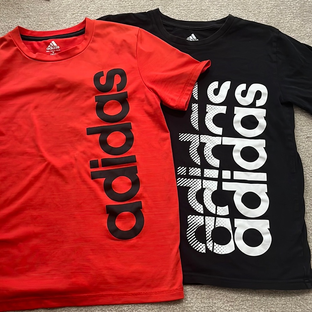 Bundle of two Boys Adidas size M (10/12) tee shirts. One black and one red